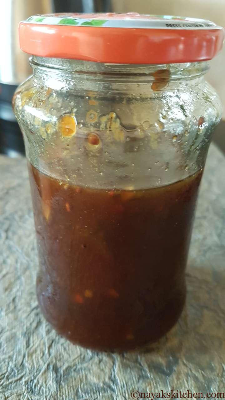 Sweet bilimbi pickle in a glass jar