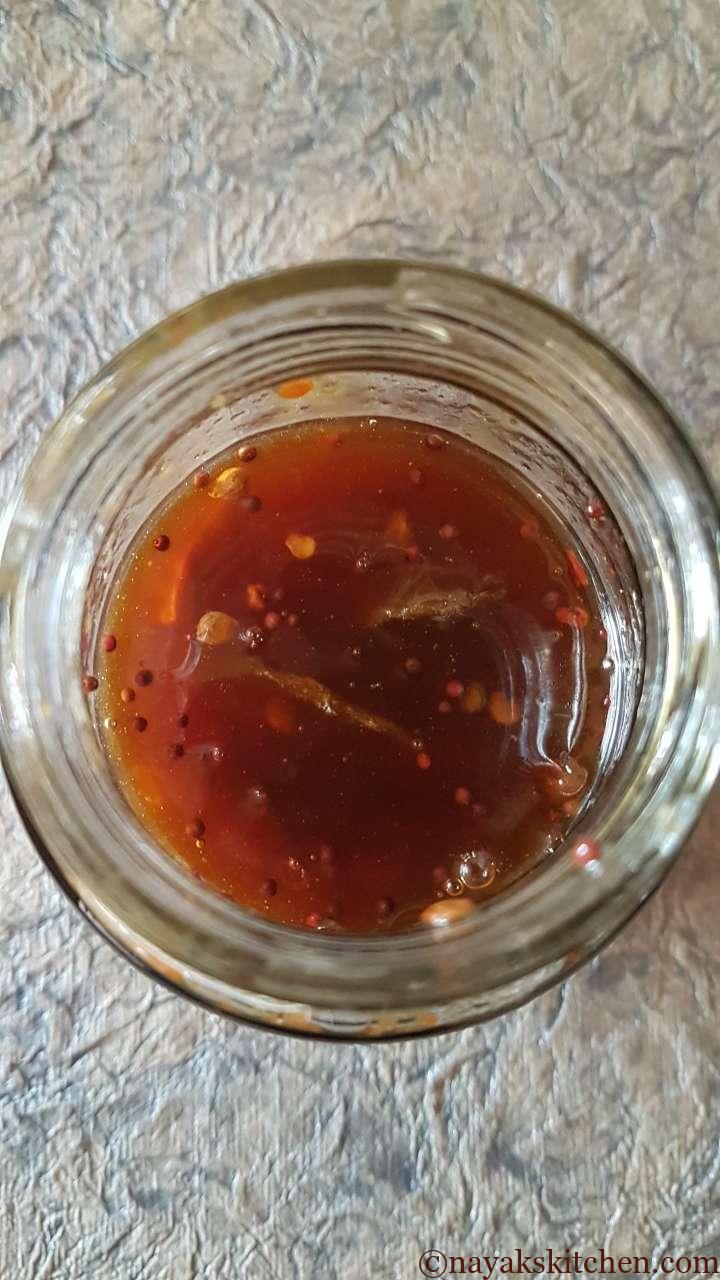 Sweet bilimbi pickle in a glass jar