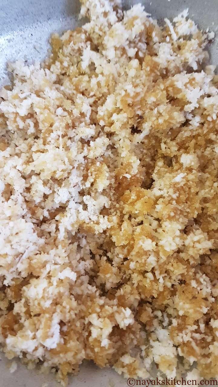 Mixing jaggery and coconut well