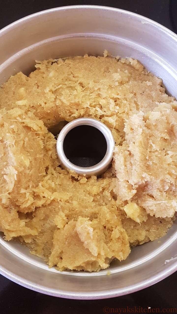 Adding mixture to cake pot