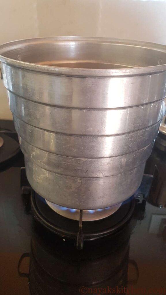 Heating water in a idli steamer