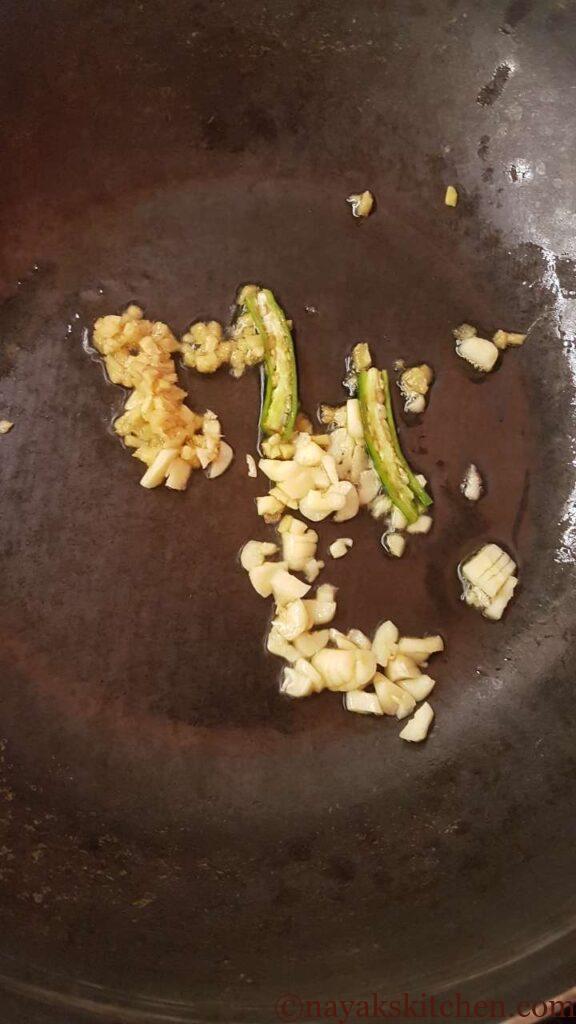 Adding ginger, garlic and green chillies