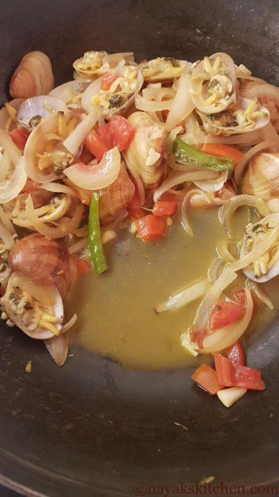 Water released while cooking clams masala