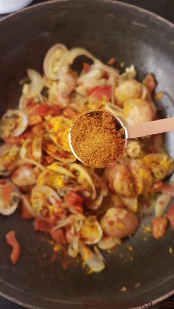 Adding garam masala powder