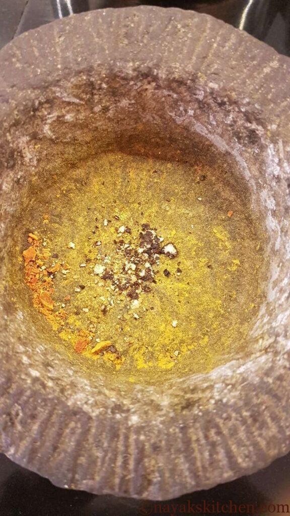 Crushed pepper in a mortar and pestle