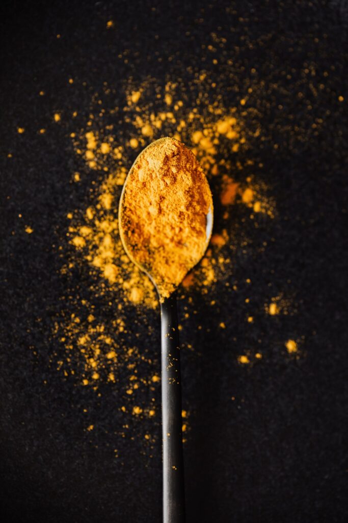 Turmeric powder in a spoon
