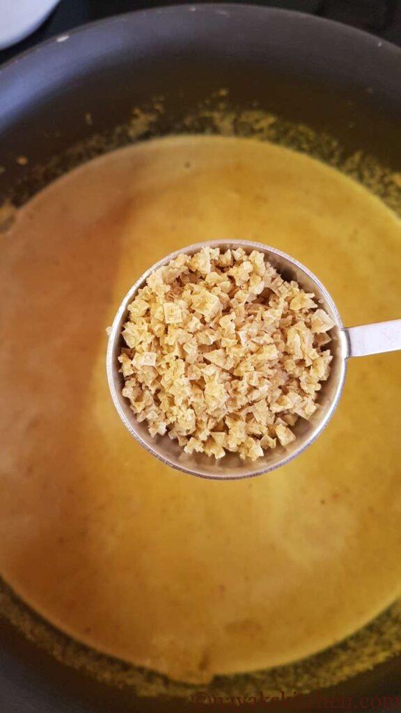 Adding salt to tisrya masala