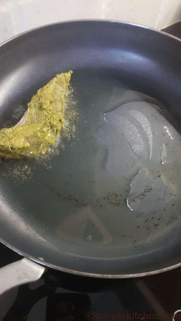 Placing chicken legs in the pan