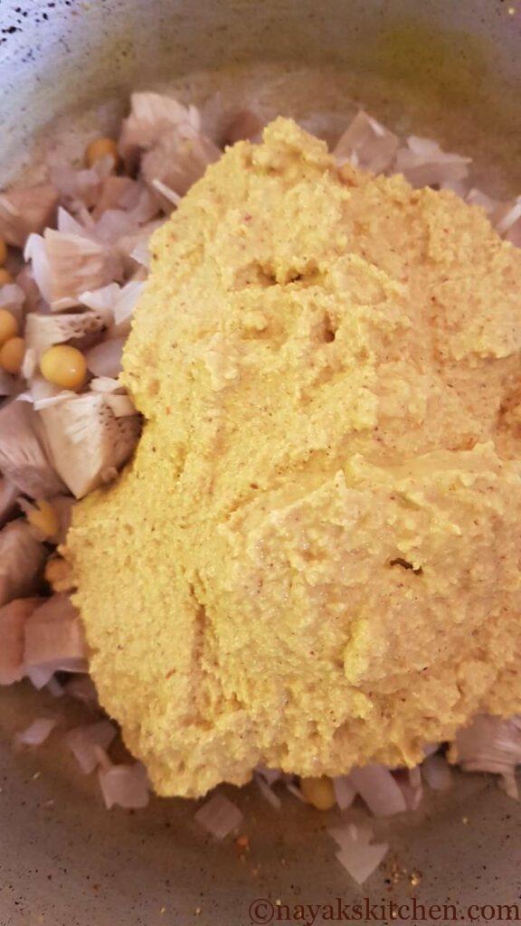 Adding ground masala paste