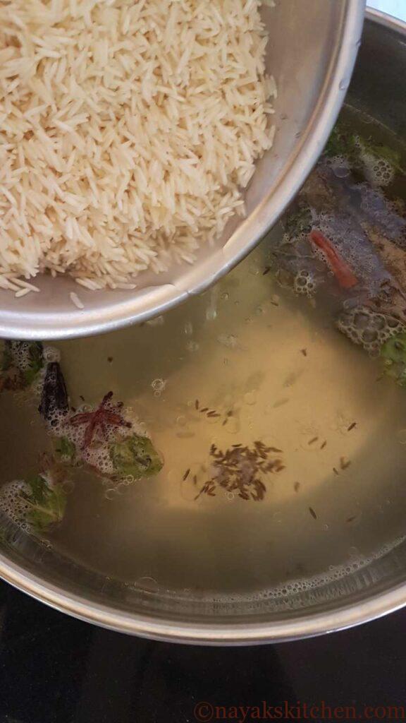 Adding soaked rice to boiling water