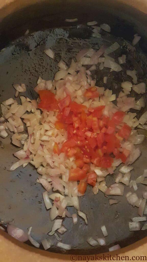 Adding chopped tomato