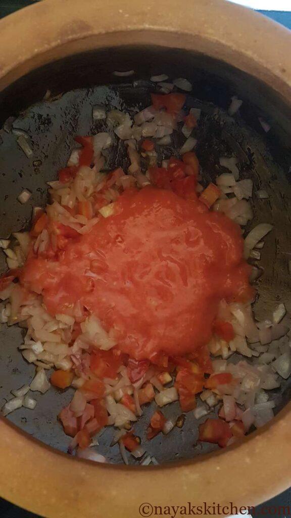 Adding tomato puree