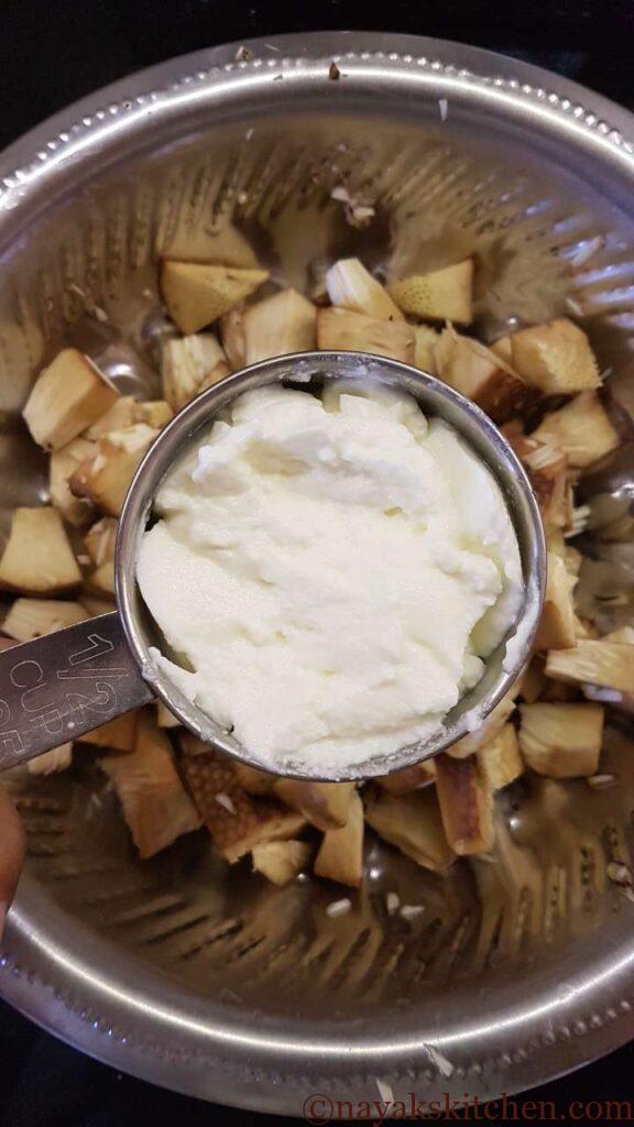 Adding curd to jackfruit pieces