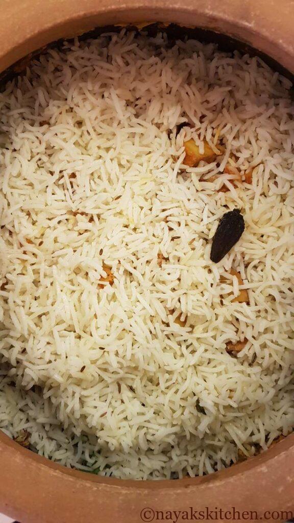 Adding last layer of basmati rice