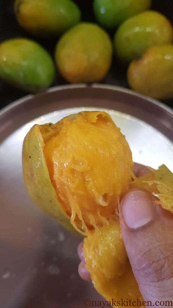 Peeling the ripe mangoes