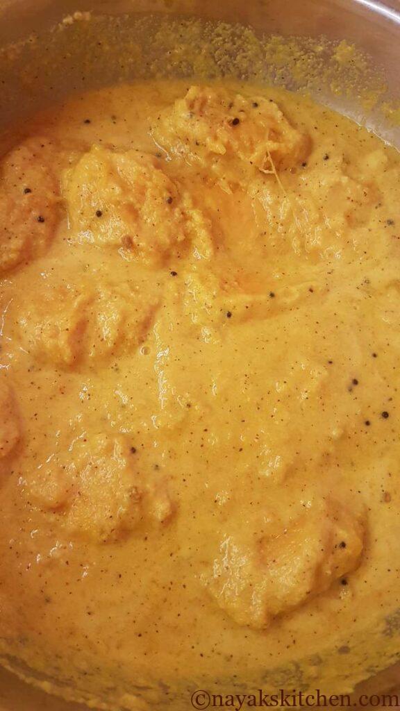 Mixing the ghotan with the masala paste well